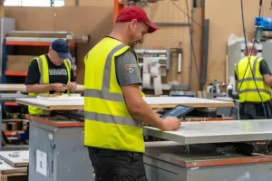 New team members at the assembly benches Integrated Doorsets Manufacturing